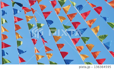 Colorful triangular flags waving in the wind in Moscow Colorful triangular flags waving in the wind in Moscow 136364595