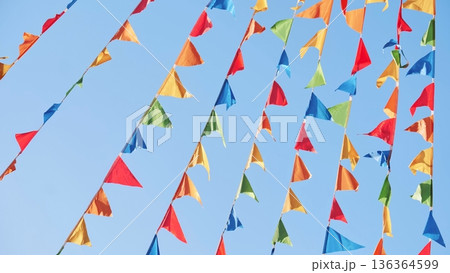 Colorful triangular flags waving in the wind in Moscow 136364599