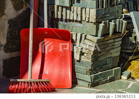 Red broom and shovel outdoor 136365213