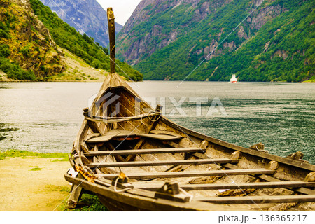 Old viking boat and ferryboat on fjord, Norway 136365217