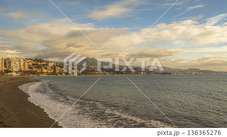 Sunny Malaga Beachfront Cityscape With Palm Trees, Ocean, and Mountain Backdrop at Dusk Sunny Malaga Beachfront Cityscape With Palm Trees, Ocean, and Mountain Backdrop at Dusk 136365276