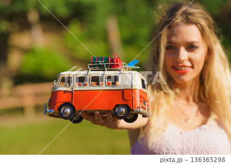 Woman holding hippie van object model Woman holding hippie van object model 136365298