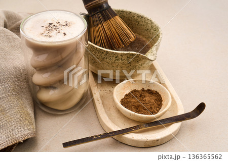 Hojicha latte with roasted green tea and whisk Hojicha latte with roasted green tea and whisk 136365562