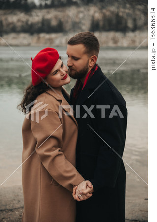 Couple enjoys time together on Valentines Day by the water, celebrating their love and connection in nature Couple enjoys time together on Valentines Day by the water, celebrating their love and connection in nature 136366314