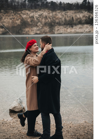 Couple shares a romantic moment by the water on Valentines Day celebrating their love together 136366326