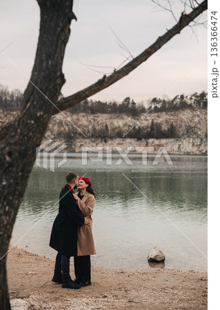 Couple sharing a moment by the lake on Valentines Day in a natural setting 136366474
