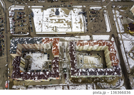 Top view of winter city landscape with tall buildings. Drone aerial photography. Top view of winter city landscape with tall buildings. Drone aerial photography. 136366836