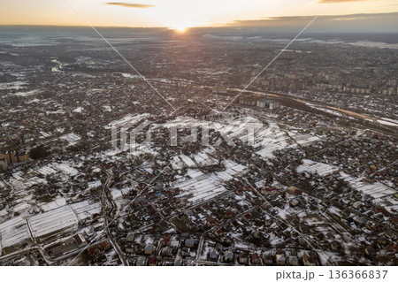 Top view of city suburbs or small town nice houses on winter morning on cloudy sky background. Aerial drone photography concept. 136366837