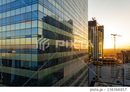 Miami, Florida. USA big city urban landscape at sunset. Developing American megapolis with new high-rise buildings under construction 136366857