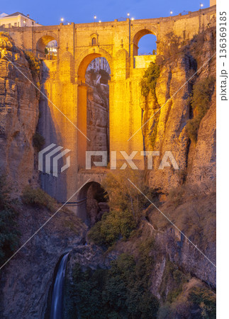 Evening View of Puente Nuevo in Ronda with Illuminated Bridge and Waterfall Evening View of Puente Nuevo in Ronda with Illuminated Bridge and Waterfall 136369185