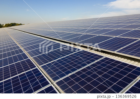 Solar rooftop on commercial structure. Photovoltaic panels for producing of clean ecological electrical energy. Concept of autonomous building 136369526