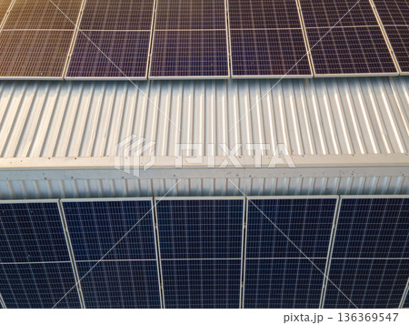 Photovoltaic panels for producing clean ecological electric energy. Commercial building with solar roof. Renewable electricity with zero emission concept. 136369547