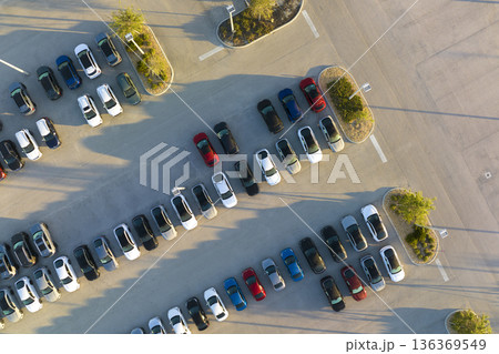 Aerial view of dealership parking lot with many brand new cars for sale. Development of american automotive industry concept 136369549
