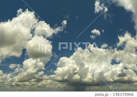 Rainstorm shower in Florida in humid summer season. Rain water pouring down from stormy clouds 136370908