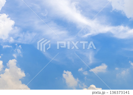 Tropical summer blue sky fluffy white cloud summertime on light sunny day cloudscape. Clear bright blue skyline spring sunlight climate background. Heaven blue environment ecology high scenic nature. 136373141