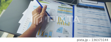 Banner Businesswoman reading financial graph charts business info with computer laptop. Panorama Women hands using laptop on office desk. Hands of business woman working office with copy space 136373144
