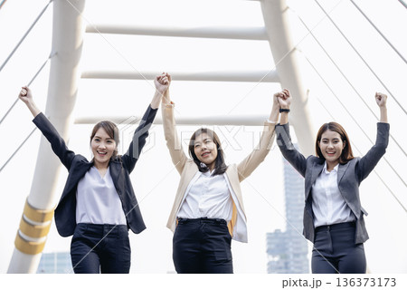 Banner Happy Diversity Teams multiethnic Partners standing with hands together in modern city. Panorama Teamwork group of multi racial confident happiness people joining trust teams partners outdoor Banner Happy Diversity Teams multiethnic Partners standing with hands together in modern city. Panorama Teamwork group of multi racial confident happiness people joining trust teams partners outdoor 136373173