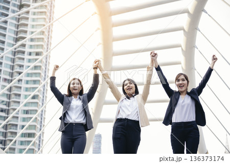 Banner Happy Diversity Teams multiethnic Partners standing with hands together in modern city. Panorama Teamwork group of multi racial confident happiness people joining trust teams partners outdoor 136373174