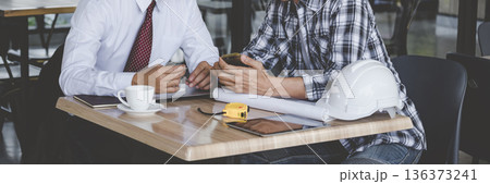 Banner Contractor construction engineer meeting on architect table at construction site. Businessman engineer manager discuss talk together foreman team builder using measure tape with copy space Banner Contractor construction engineer meeting on architect table at construction site. Businessman engineer manager discuss talk together foreman team builder using measure tape with copy space 136373241