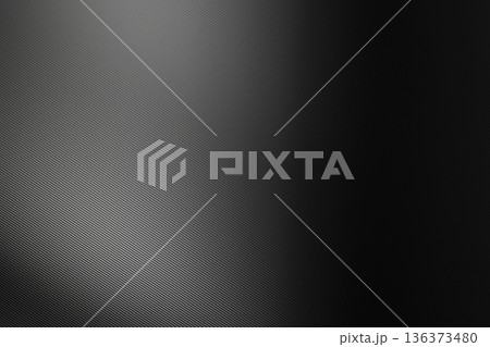 Black carbon fiber texture with subtle diagonal mesh patterns and elegant soft lighting for high tech background 136373480