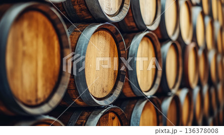 Old wine cellar wooden barrel storage rustic oak cask aging traditional winery background pattern warm vintage wood texture atmosphere 136378008