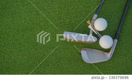 Golf club and golf balls on a green lawn in a beautiful golf course with morning sunshine. 136378696
