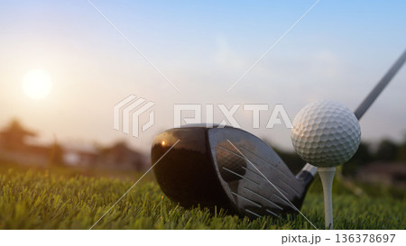 Golf clubs and balls on a green lawn in a beautiful golf course with morning sunshine. Golf clubs and balls on a green lawn in a beautiful golf course with morning sunshine. 136378697