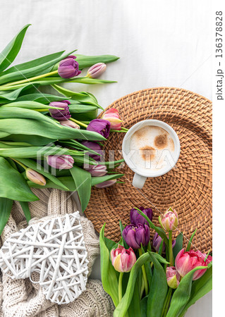 Cozy composition with flowers and coffee on a white background, top view. 136378828