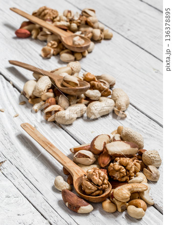 different nuts in plates 136378895