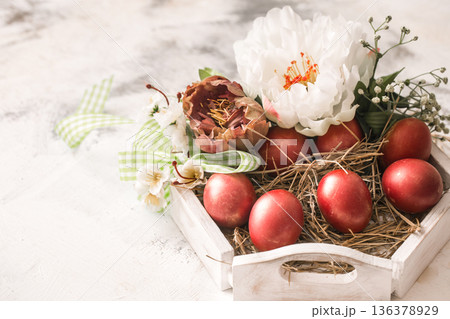 Easter background with a basket and red eggs with flowers Easter background with a basket and red eggs with flowers 136378929