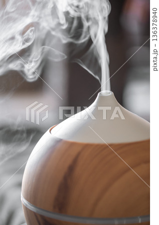Modern oil aroma diffuser close up on a blurred background. 136378940