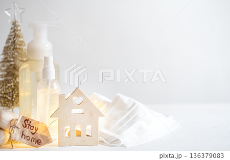 Christmas background with coronavirus personal protective equipment and decor details copy space. 136379083