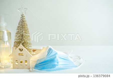 Christmas background with coronavirus personal protective equipment and decor details copy space. 136379084