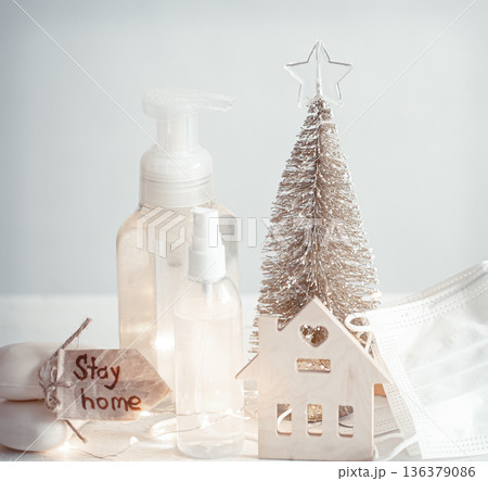 Christmas background with coronavirus personal protective equipment and decor details copy space. 136379086