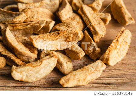 Homemade dried organic apple sliced on wood background. 136379148