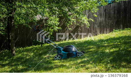 lawnmower on green grass lawnmower on green grass 136379168