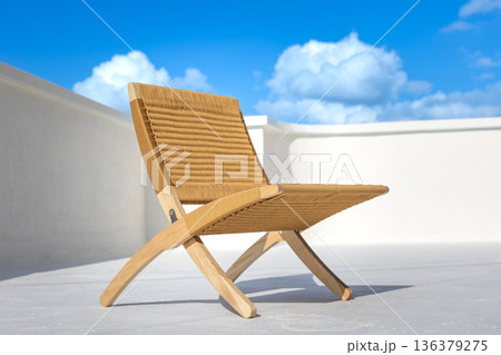 Stylish wicker chair on a light sky background. Decor concept. 136379275