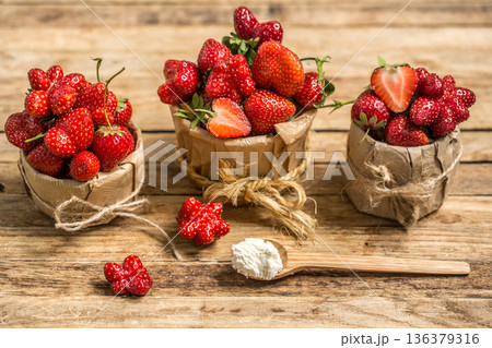 arrangement with fresh strawberries on wooden background arrangement with fresh strawberries on wooden background 136379316