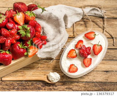 arrangement with fresh strawberries on wooden background 136379317