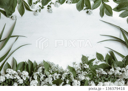 Floral arrangement with spring leaves and flowers copy space. 136379418