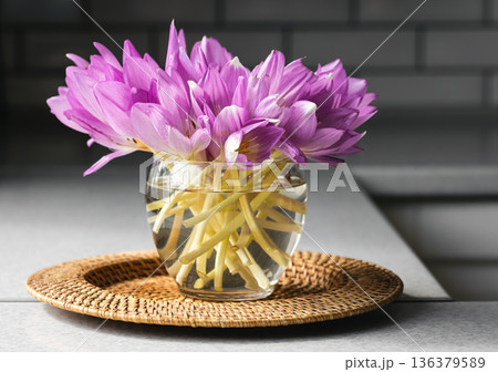 Bunch of crocus flowers in a glass vase in the kitchen. Bunch of crocus flowers in a glass vase in the kitchen. 136379589