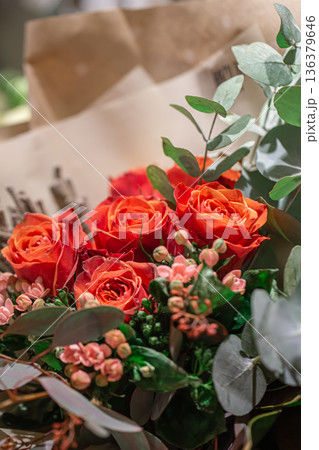 Close-up of a bouquet of roses on a blurred background. 136379646