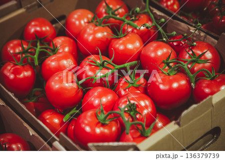 Close-up, tomatoes in a box on the counter. 136379739