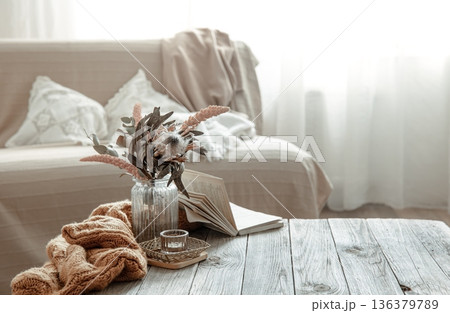 Cozy home still life with a book and decorative elements. 136379789