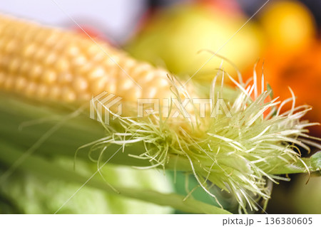 Natural background, fresh corn closeup, macro shot. Natural background, fresh corn closeup, macro shot. 136380605