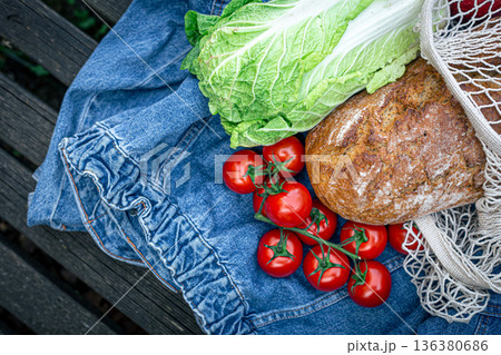 Vegetables and bread in a shopping bag, picnic concept. 136380686