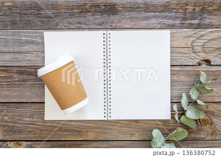 Paper disposable cup and notepad made from recycled paper cups, top view. 136380752