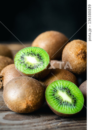 Ripe fruits of kiwi cut and whole, close -up. 136380839