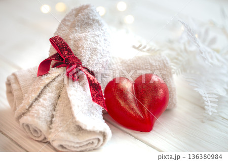 Spa composition with heart shaped soap towel close up. 136380984