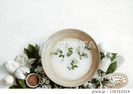 Spa composition with water for beauty treatments and fresh flowers. 136381024